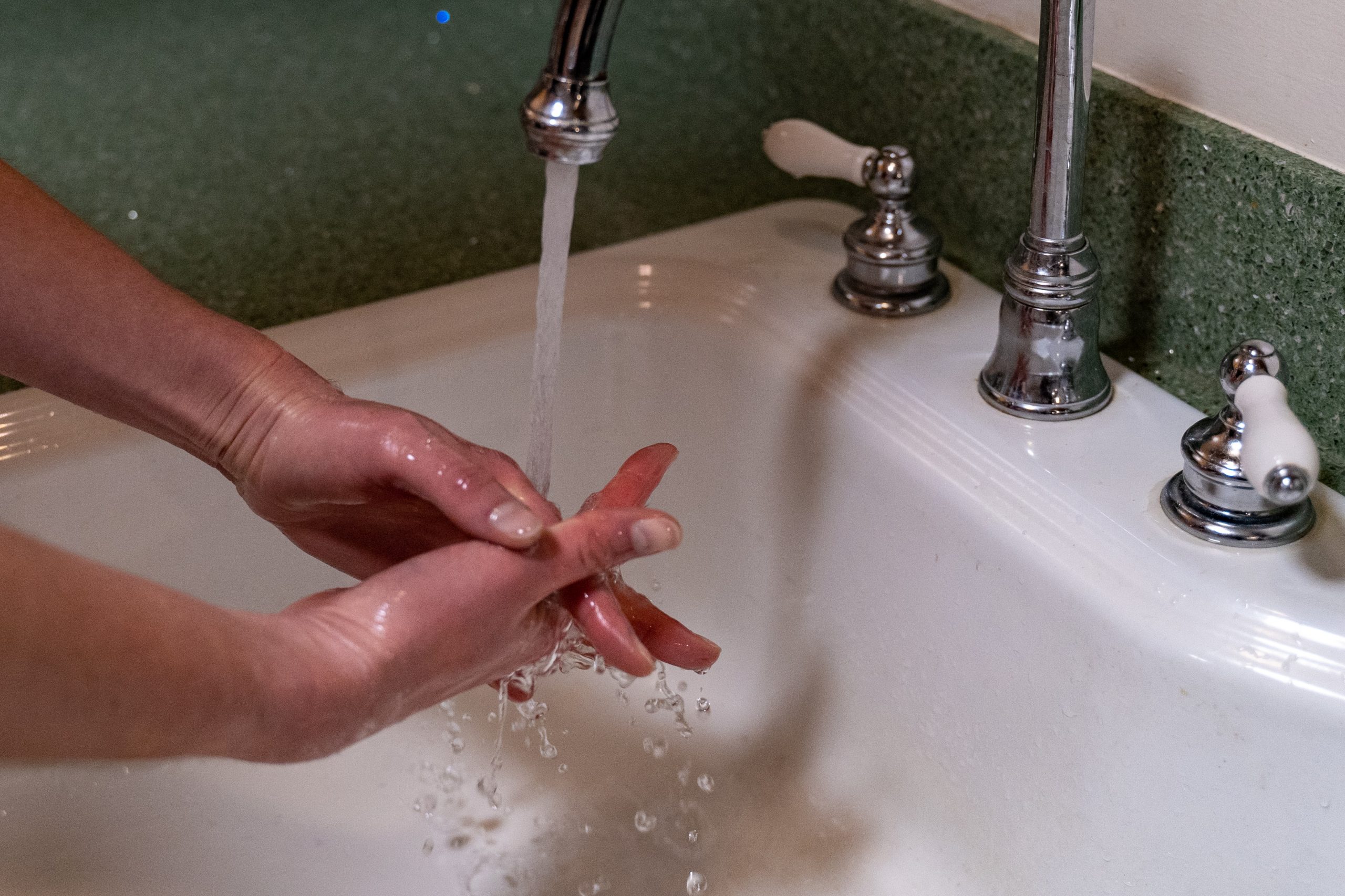 Person washing hands Photo by F Cary Snyder on Unsplash