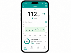 Smartphone showing a CGM app with glucose trend line and time-in-range reading